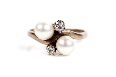 Lot 643 - A cultured pearl and diamond dress ring