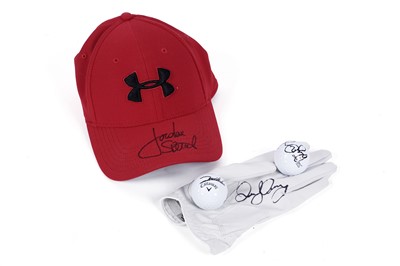 Lot 493 - Two signed golf balls; and a signed Under Armour cap