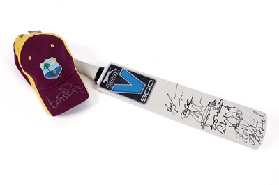 Lot 494 - A signed cricket bat and cap