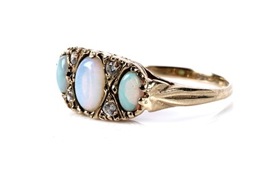 Lot 139 - An opal and diamond dress ring