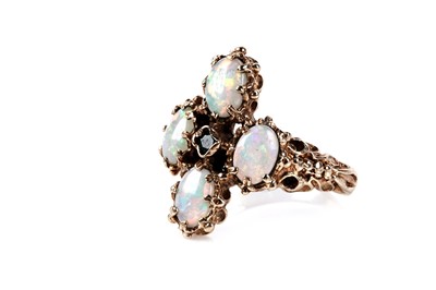 Lot 141 - An opal and emerald dress ring
