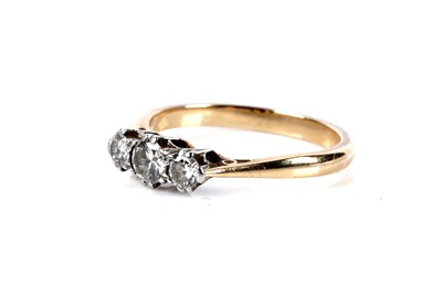 Lot 142 - A diamond three stone ring