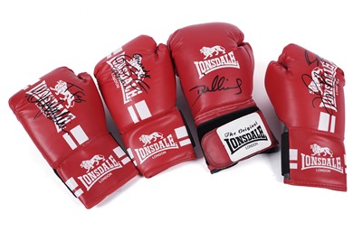 Lot 497 - A collection of four autographed boxing gloves