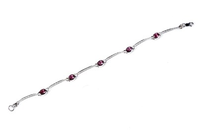 Lot 796 - A pink tourmaline and diamond line bracelet
