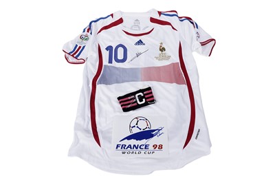 Lot 505 - An autographed Adidas France World Cup 2006 strip; and other items