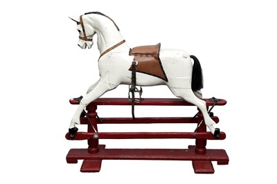 Lot 34 - A vintage white painted carved wooden rocking horse
