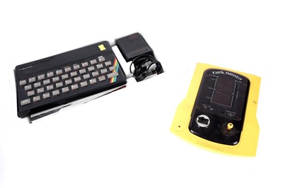 Lot 1 - A Sinclair ZX Spectrum; and a Japanese 'Puck Monster' tabletop video game console