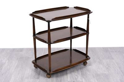 Lot 7 - Lucian Ercolani for Ercol: a model ‘458’ dark elm and beech three tier trolly