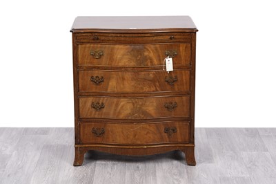 Lot 24 - A Georgian style mahogany serpentine fronts bachelor’s chest of drawers