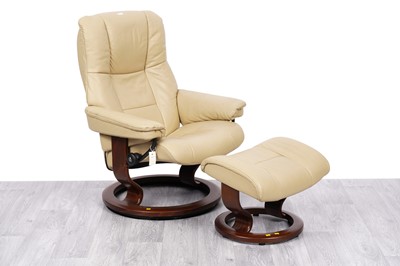 Lot 5 - A Stressless style reclining and swivel action armchair; and a matching footstool