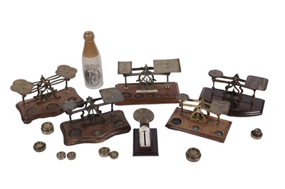 Lot 106 - Six sets of early 20th Century postage scales; and a Ross & Co stoneware bottle