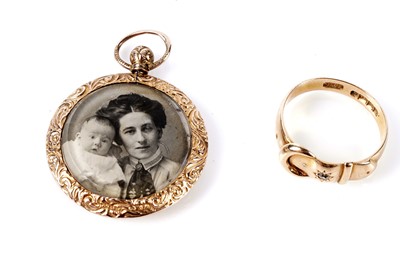 Lot 202 - An Edwardian star set diamond buckle ring; and a gold portrait pendant