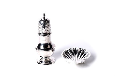 Lot 333 - A Queen Elizabeth II silver sugar caster; and a shell form dish