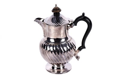 Lot 347 - A Georgian silver hot water pot