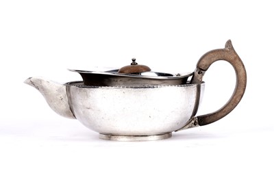 Lot 374 - A George V silver teapot