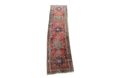 Lot 1184 - An early 20th Century Persian hand-knotted Heriz runner