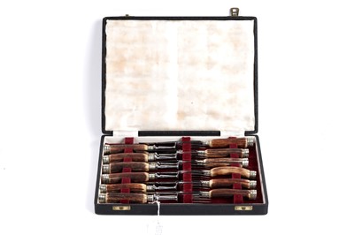 Lot 813 - A set of horn-handled stainless steel cutlery by Ernest Cockbill