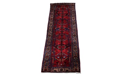 Lot 971 - A Persian hand-knotted Heriz runner