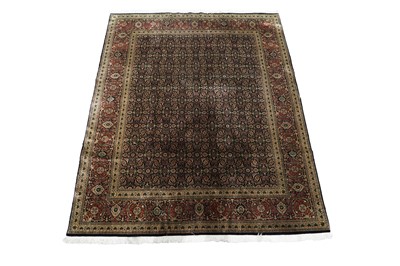 Lot 1203 - A Persian hand-knotted Tabriz carpet