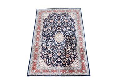 Lot 1208 - A Persian hand-knotted Qum rug