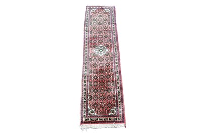 Lot 977A - A Persian hand-knotted Nahavand runner