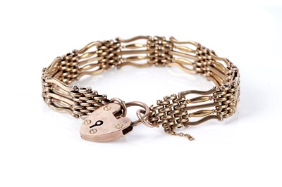 Lot 227 - A gold gatelink bracelet