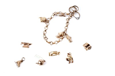 Lot 233 - A 9ct yellow gold charm bracelet; and a selection of loose charms
