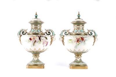 Lot 1118 - A pair of Royal Worcester vases and covers