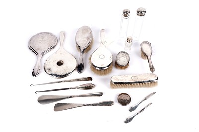 Lot 340 - A collection of silver backed dressing table accessories