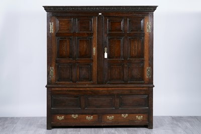 Lot 102 - A substantial Georgian carved oak cabinet