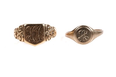 Lot 595 - A 22ct gold wedding band; two gold signet rings; and another ring