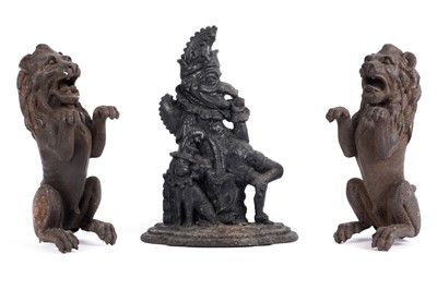 Lot 677 - A pair of Victorian style cast iron lions; and a cast iron doorstop