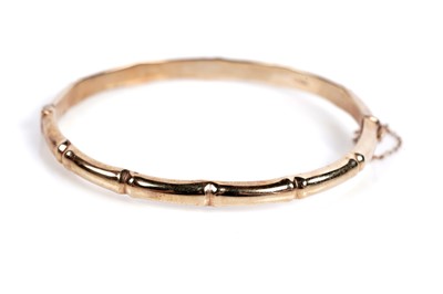 Lot 682 - A 9ct gold bamboo pattern bangle