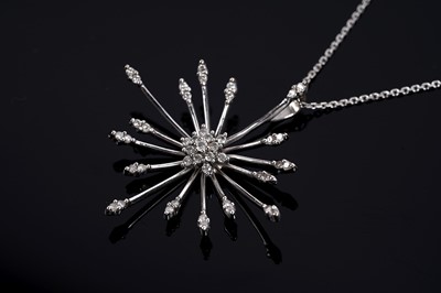 Lot 684 - A diamond cluster sunburst pendant necklace