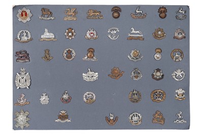 Lot 85 - A display of British regimental cap badges