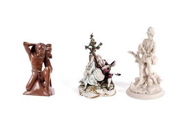 Lot 211 - A vintage carved wood figure of a warrior; a Capo di Monte figure group; and another figure