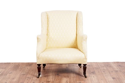 Lot 467 - Howard & Sons style: an early 20th Century wingback armchair