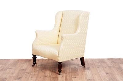 Lot 467 - Howard & Sons style: an early 20th Century wingback armchair