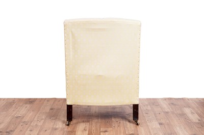 Lot 467 - Howard & Sons style: an early 20th Century wingback armchair