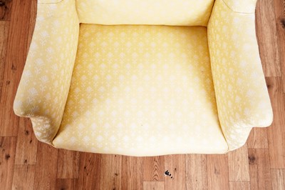 Lot 467 - Howard & Sons style: an early 20th Century wingback armchair