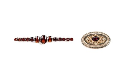 Lot 558 - A garnet and filigree brooch; and a garnet bar brooch