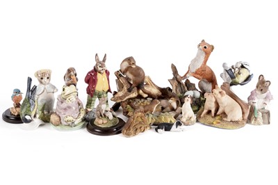Lot 773 - A collection of cast resin and ceramic figures