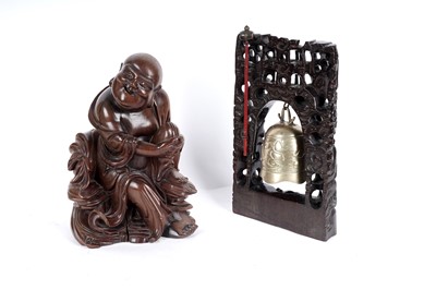 Lot 252 - An early 20th Century carved rootwood figure; and a Chinese temple bell