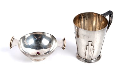 Lot 843 - A George V Art Deco silver christening cup; and quaich set with a cabochon ruby