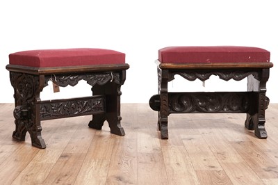 Lot 543 - A pair of Victorian Gothic revival carved oak marriage stools