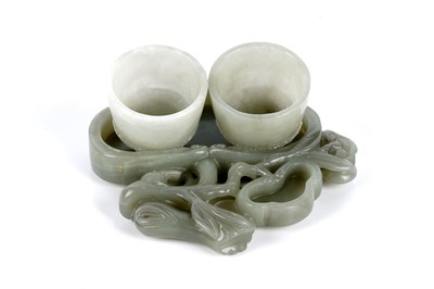 Lot 713 - A Chinese pale green Bowenite brush washer and two cups