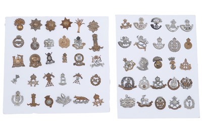 Lot 204 - Two displays of British Regimental cap badges