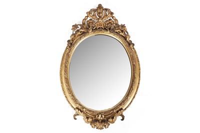 Lot 591 - An ornate 19th Century giltwood and gesso oval wall mirror