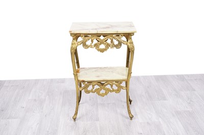Lot 19 - An ornate gilt cast metal and onyx two tier occasional table