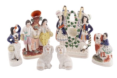 Lot 311 - A Victorian flatback pocket watch holder; and five Staffordshire figures